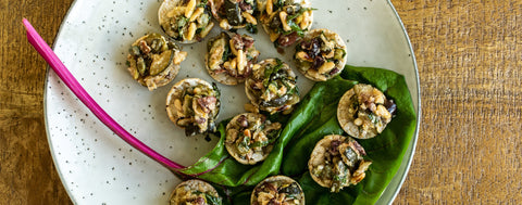 Sautéed courgette, olive, caper and pine nut canapés